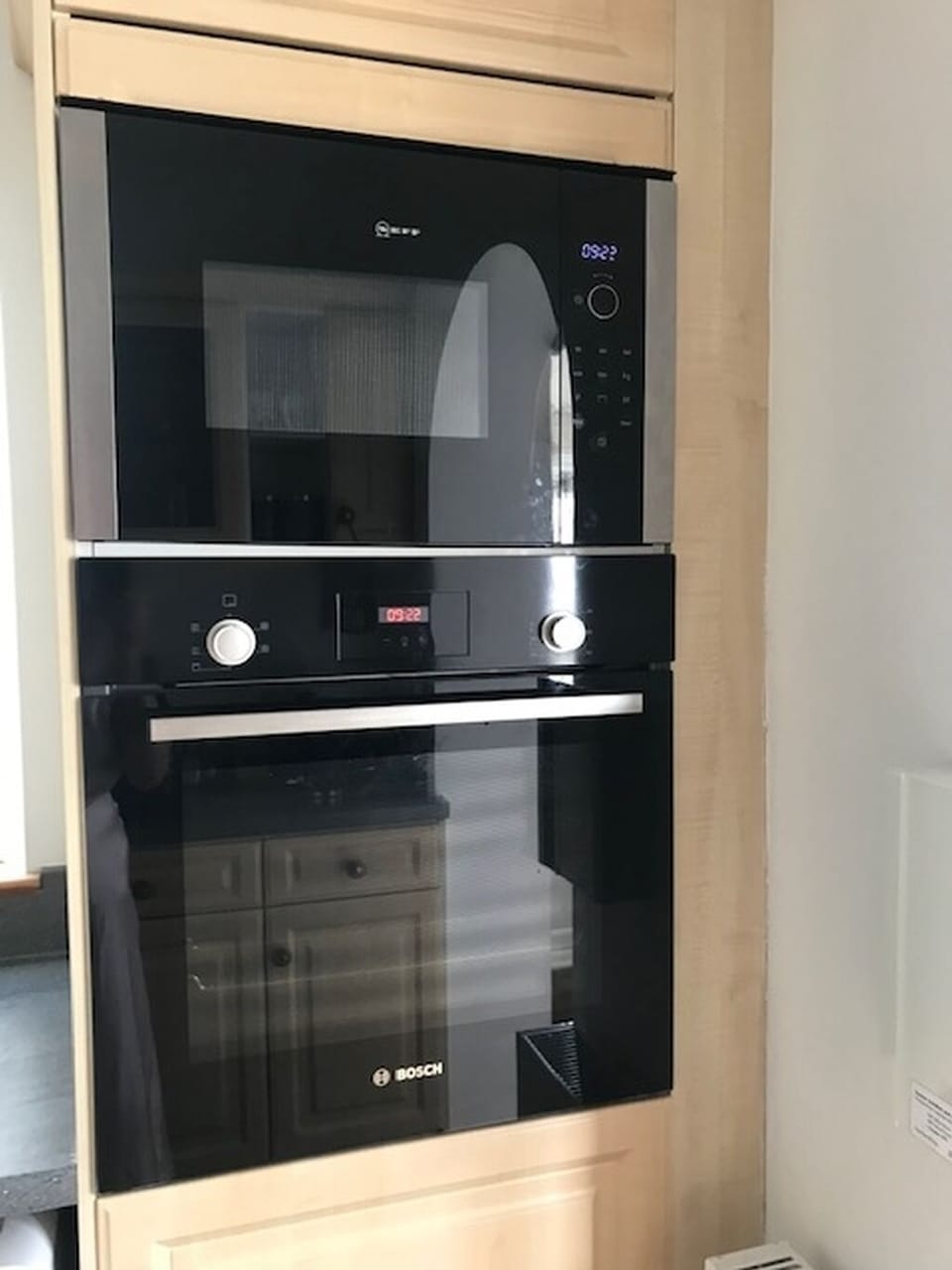 Black stylish Bosch fan oven and grill, with an easy to use Neff microwave