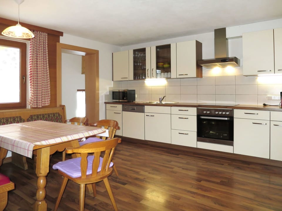 Furniture, Room, Countertop, Cabinetry, Kitchen, Property, Interior Design, Floor, Wood Flooring, Building