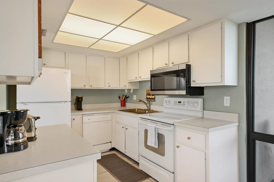 Fully-equipped kitchen with balcony access