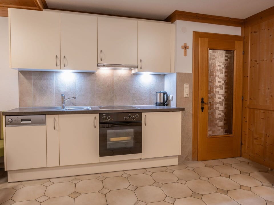 Flooring, Countertop, Kitchen, Interior Design, Wood, Cabinetry, Floor, Furniture, Kitchen Appliance, Ceiling