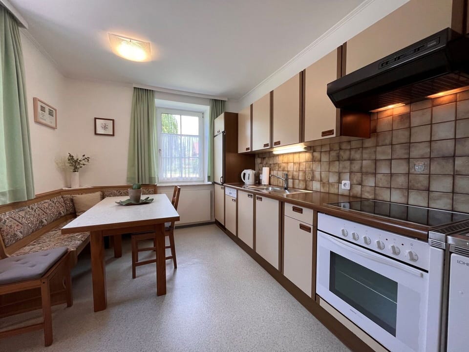 Furniture, Cabinetry, Countertop, Window, Table, Kitchen Stove, Wood, Interior Design, Houseplant, Lighting