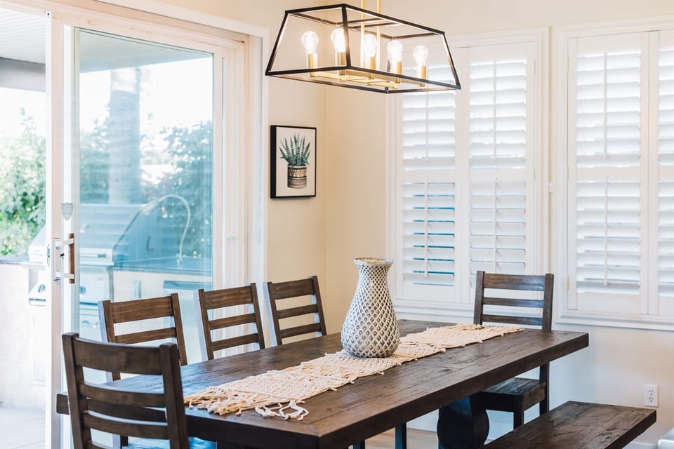 Step into a culinary haven where the kitchen is fully equipped for all your gourmet adventures. Open to a cozy living area and stunning views of the golf course—perfect for relaxing and entertaining.