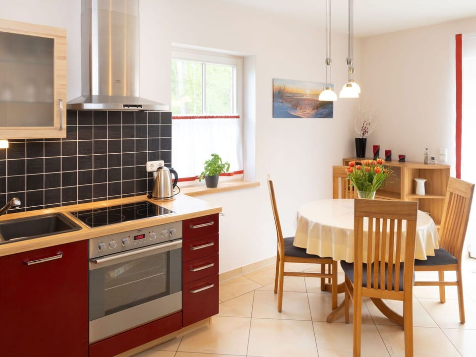 Furniture, Flooring, Kitchen, Interior Design, Kitchen Appliance, Countertop, Cabinetry, Wood, Floor, Chair