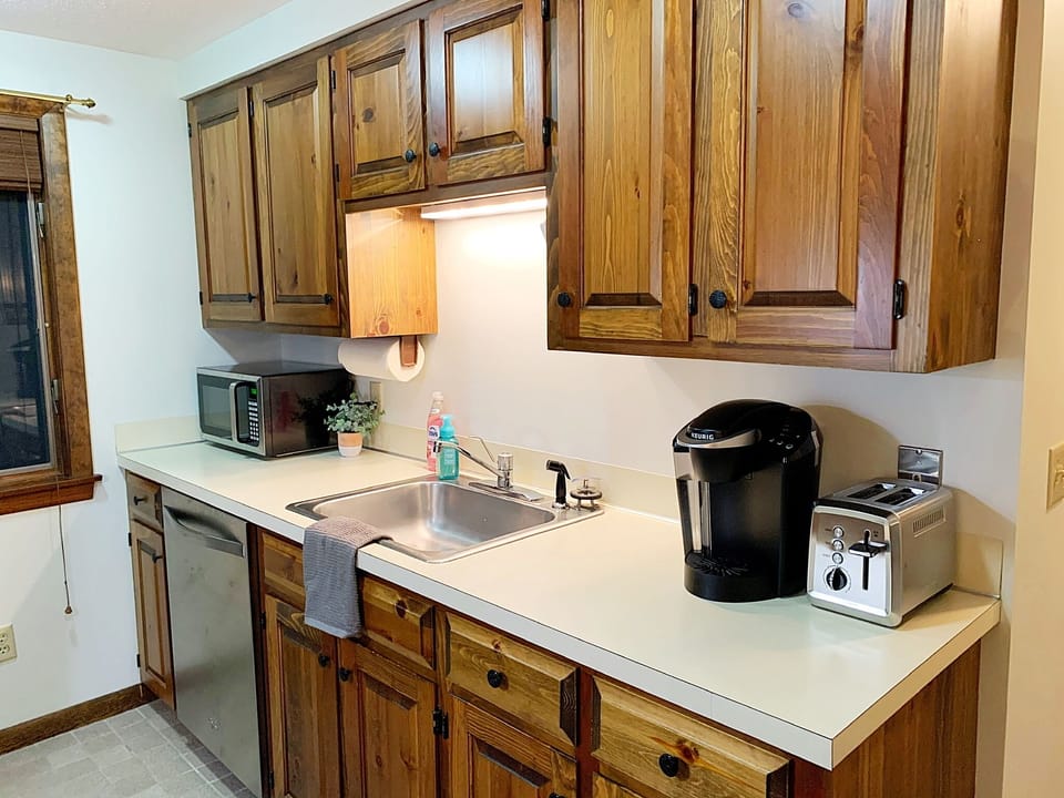 Well appointed galley kitchen with new stainless steel appliances. 