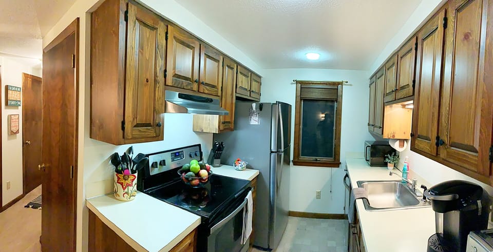 Kitchen with stainless steel appliances. 