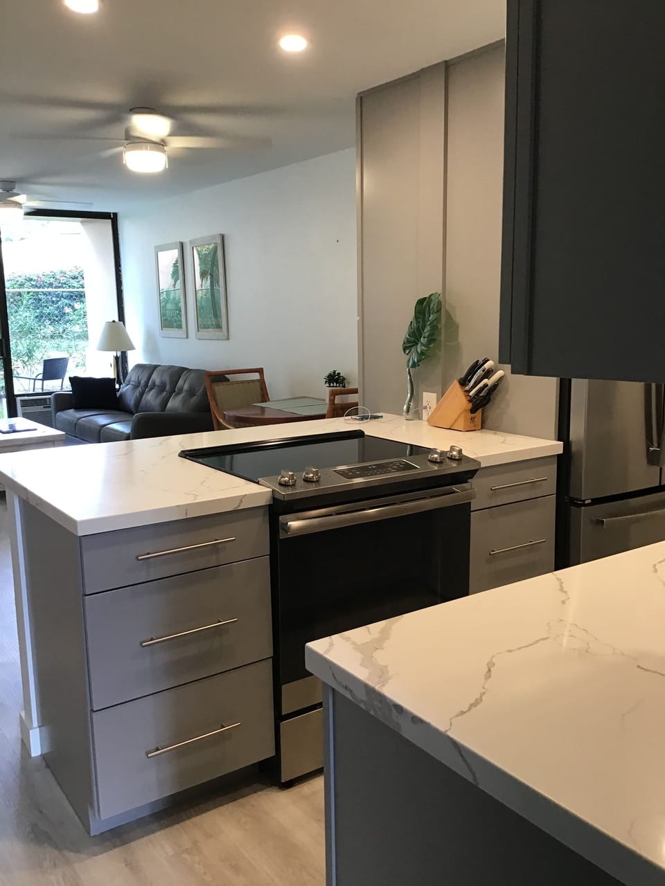 Kitchen with modern grey with white counters 