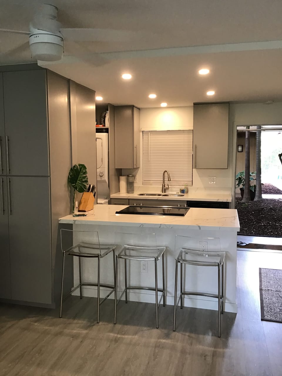 View of kitchen.  Pantry cabinet has microwave. 