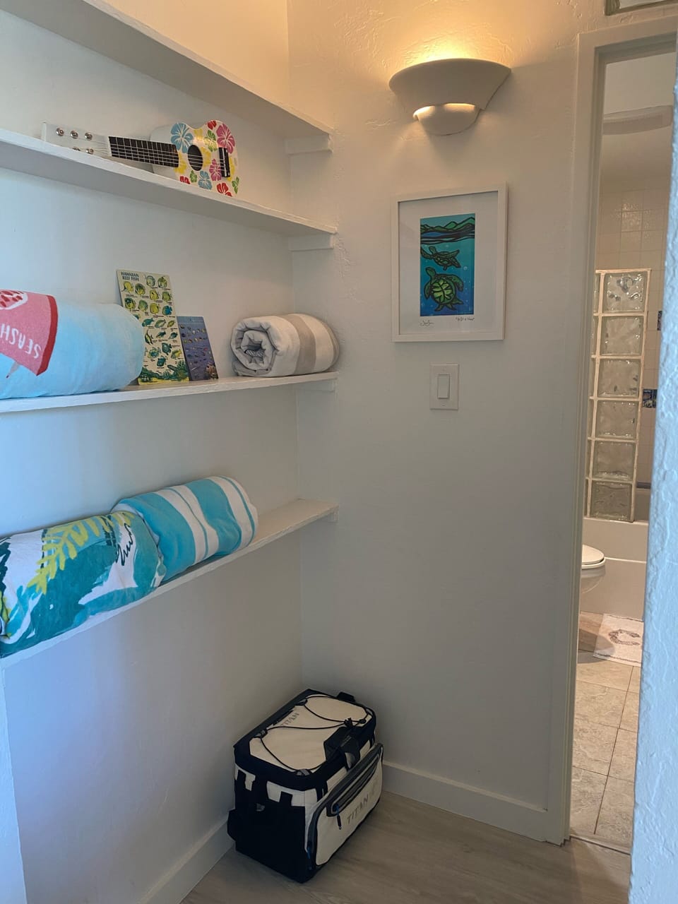 Beach towels outside of second bed/bath area