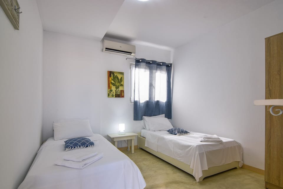 Comfortable bedroom of the cottage next to the beach, Rethymno, Crete