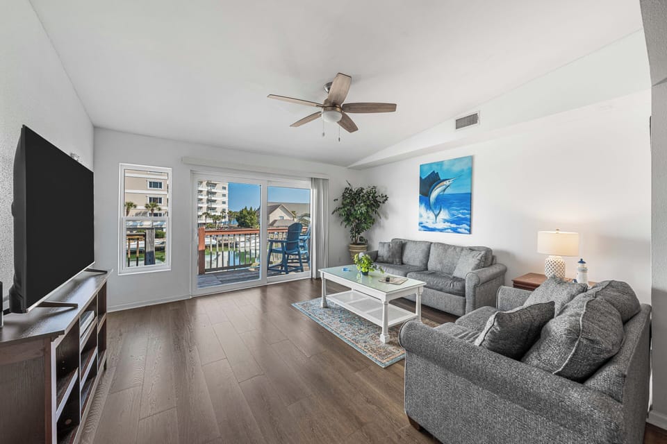 2nd floor living area with big screen TV and queen pull out couch.