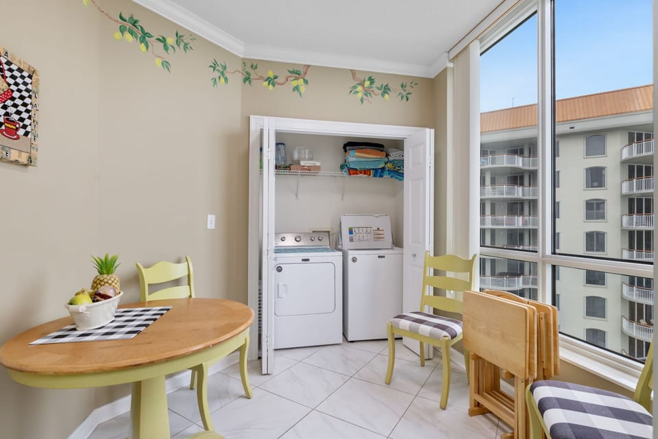 Kitchen table with four chairs plus washer/dryer. -- one of two in the condo.