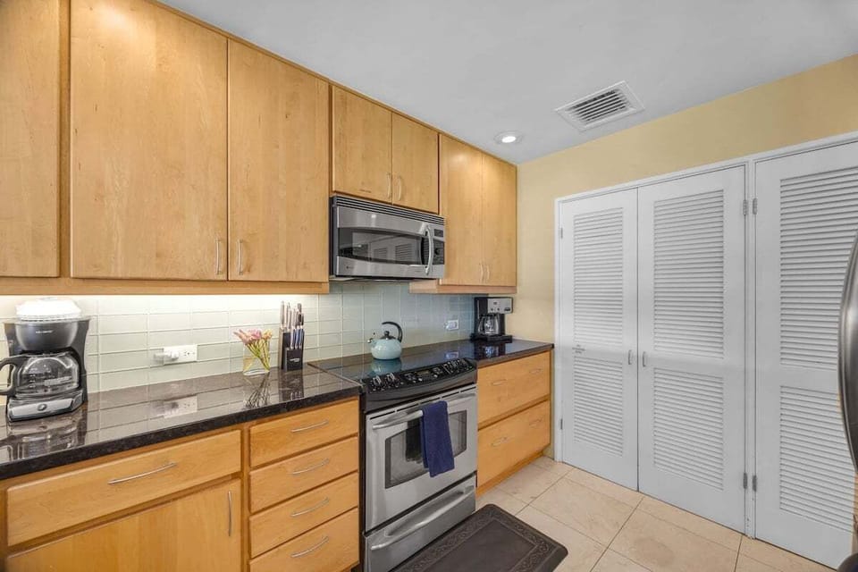 Enjoy cooking your favorite meal in your fully furnished kitchen with stainless steel appliances