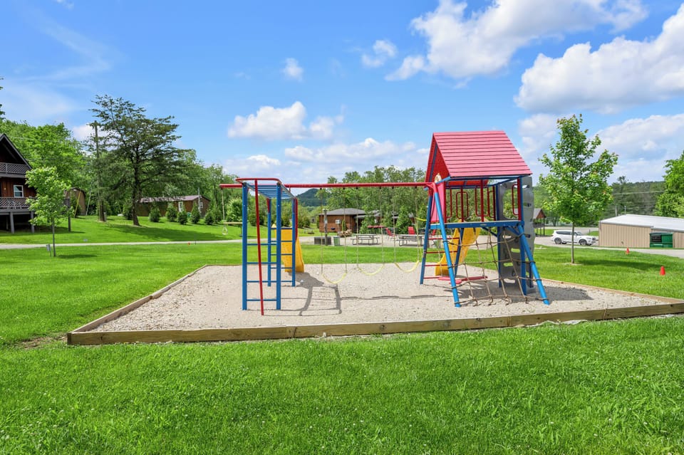 Playground/Picnic Area located at sister property at Cave Run Lodge 1 min away.