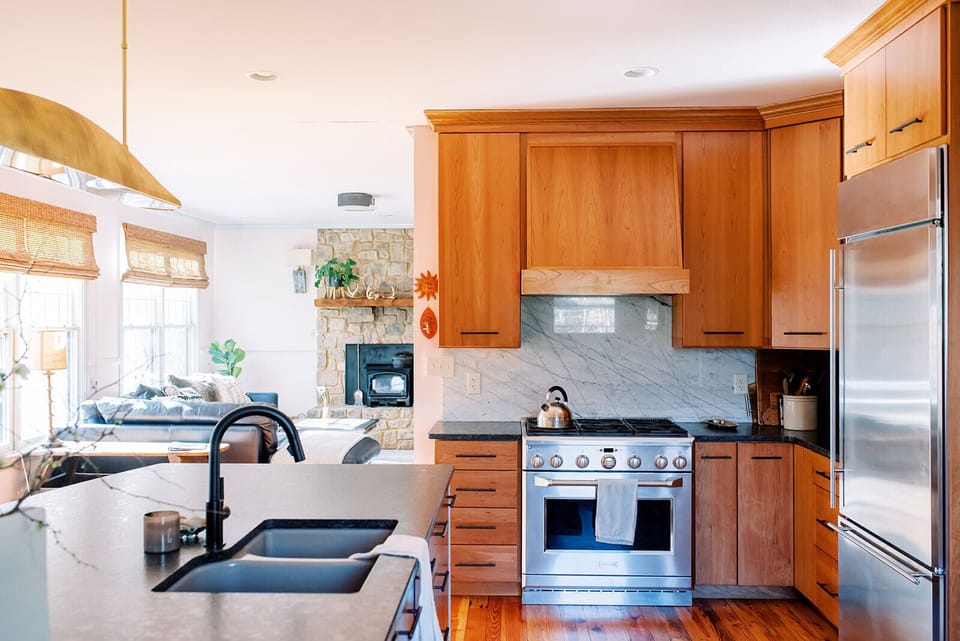 The kitchen connects to a dining room, breakfast nook, and living area 