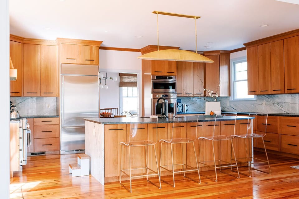 The stocked kitchen has two stoves and plenty of room to gather