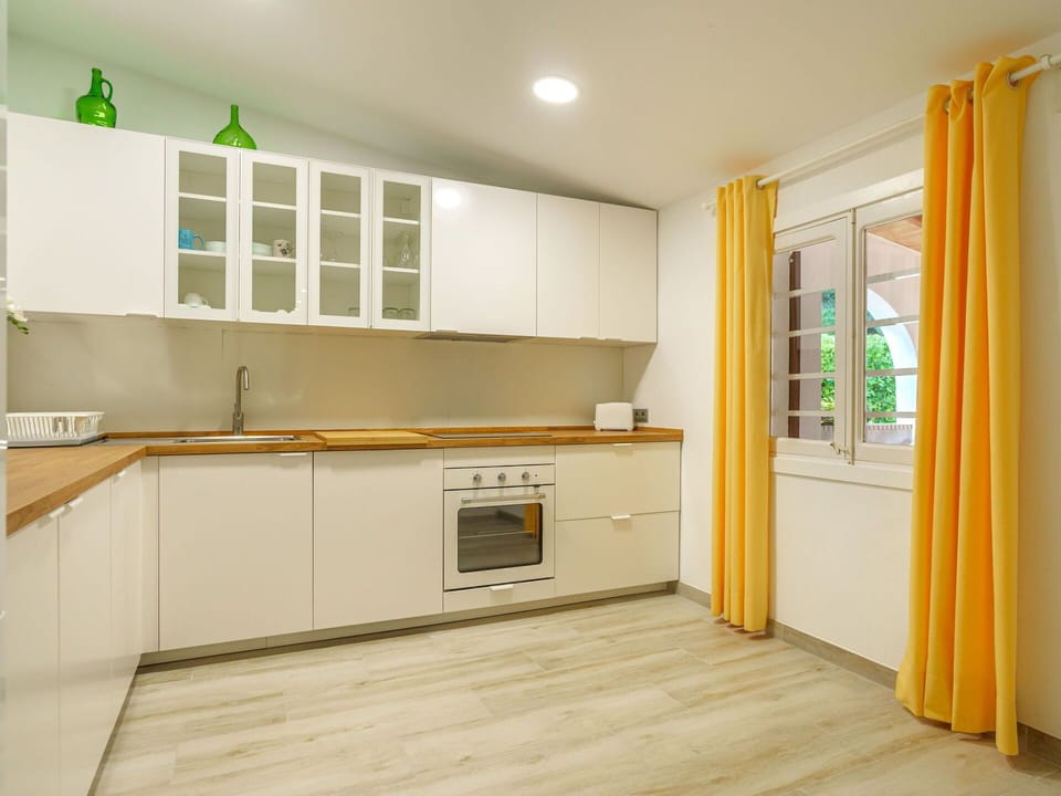 Cabinetry, Countertop, Building, Kitchen Stove, Window, Kitchen Appliance, Wood, Kitchen, Interior Design, Curtain