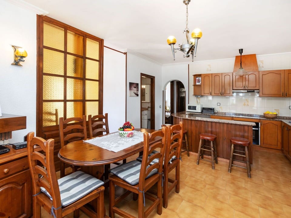 Table, Furniture, Property, Chair, Lighting, Wood, Interior Design, Yellow, Cabinetry, Countertop