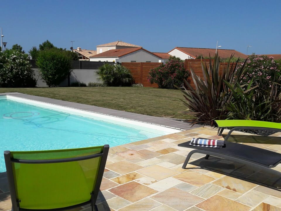 Water, Plant, Property, Furniture, Swimming Pool, Azure, Building, Sky, Outdoor Furniture, Shade