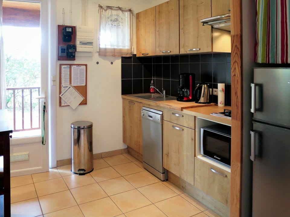 Room, Countertop, Furniture, Cabinetry, Property, Kitchen, Major Appliance, Building, Floor, Refrigerator