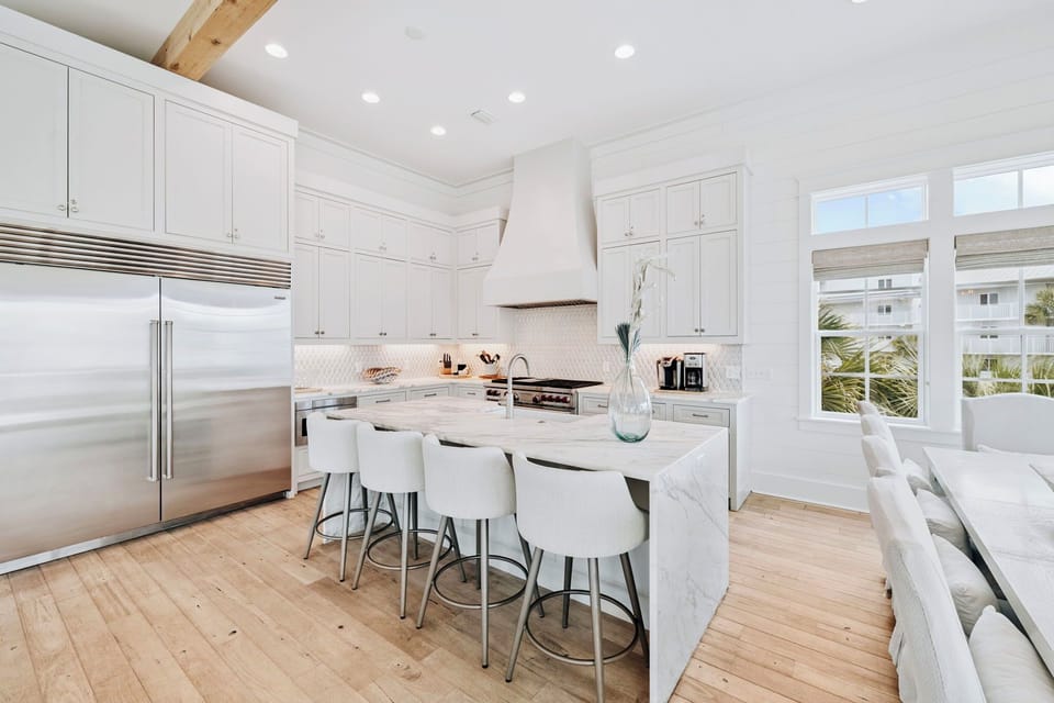 Cook and gather in your gourmet kitchen featuring marble countertops, premium appliances, and a spacious island perfect for memorable meals together.