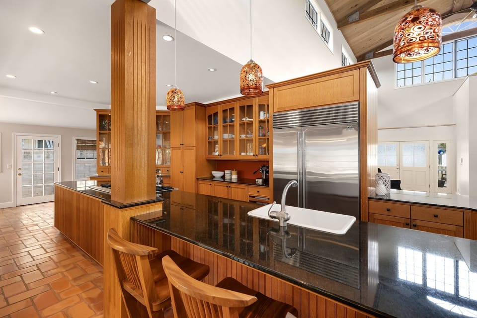 Inviting and functional space with bar seating and natural light.