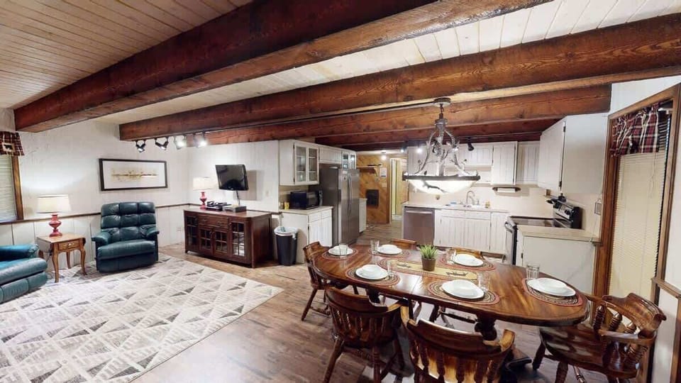 Upon entrance you are greeted by the dining area, living room, and kitchen.