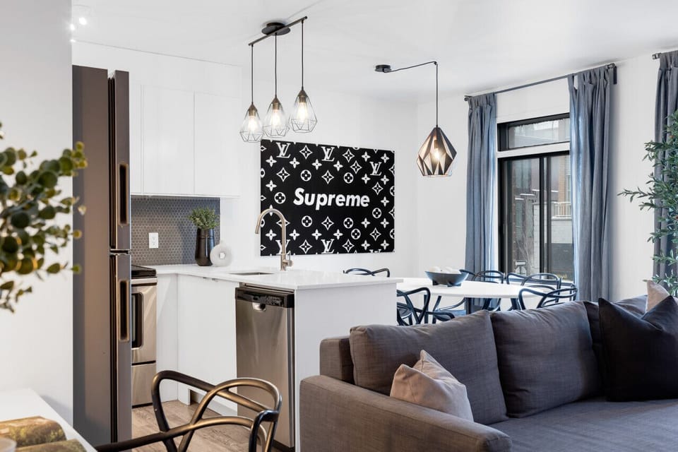 Dining Room: Featuring luxurious dining table with comfortable chairs, and a Smart TV, fully equipped for you to prepare and enjoy large group events.