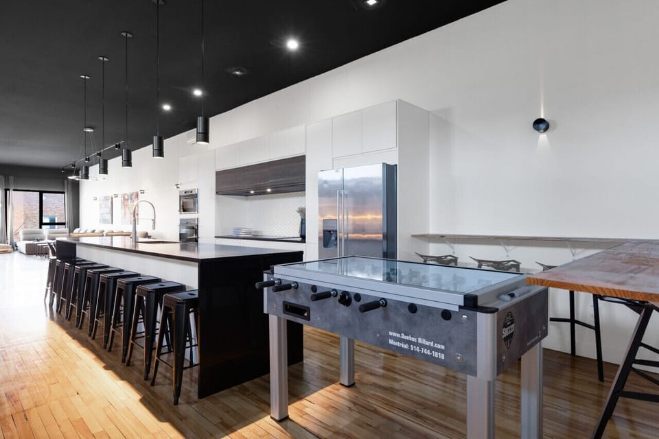 Game room: This luxurious play area features a professional poker table with comfortable chairs and cup holders, perfect for game nights. The space also includes a foosball table for added entertainment. Poker chips, cards, and all accessories for Texas H