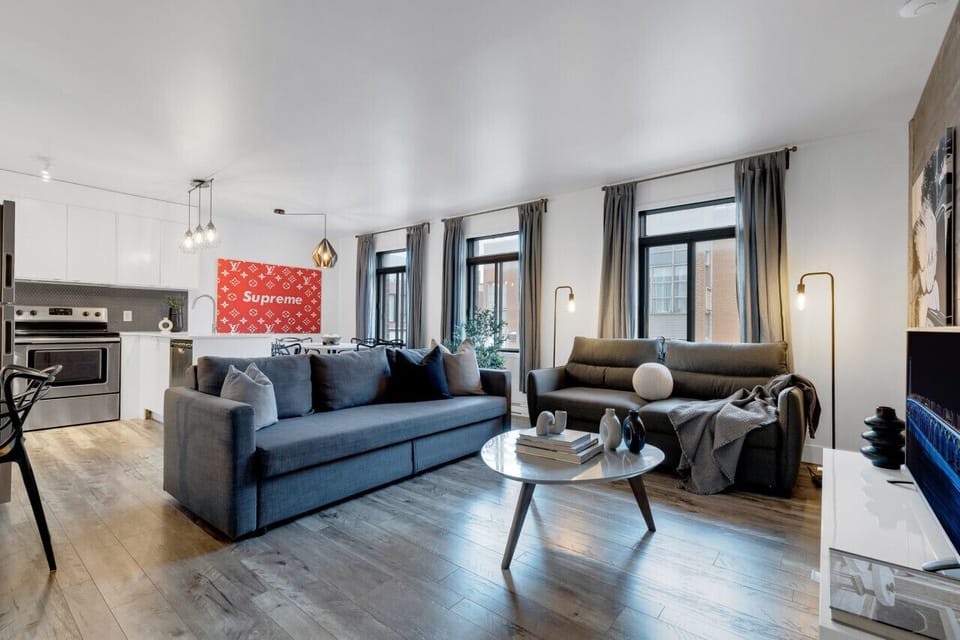 Living Room: Features 2 queen-size sofa beds with Art Deco, and a Smart HD TV with Netflix, YouTube, and Prime.