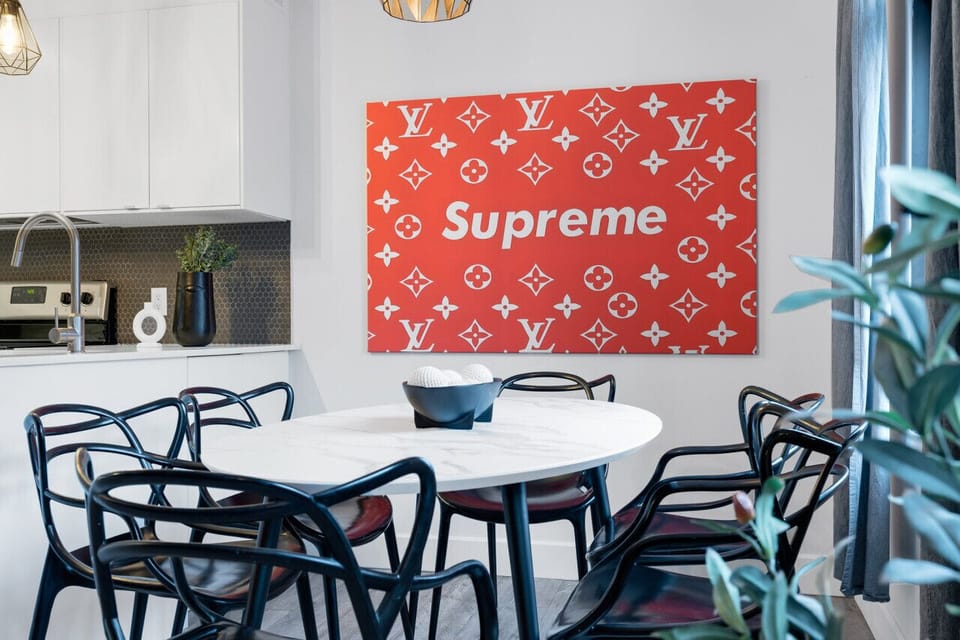 Dining Room: Featuring luxurious dining table with comfortable chairs, and a Smart TV, fully equipped for you to prepare and enjoy large group events.
