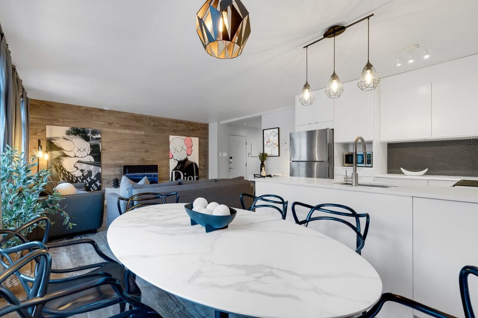 Dining Room: Featuring luxurious dining table with comfortable chairs, and a Smart TV, fully equipped for you to prepare and enjoy large group events.