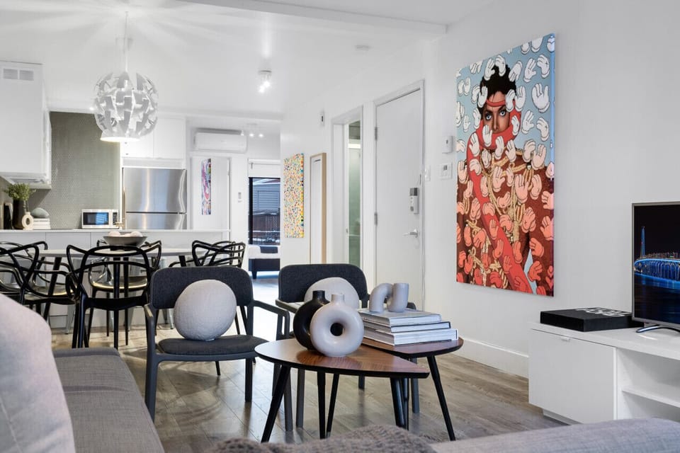Dining Room: This space features a luxurious dining table with comfortable chairs, bar stools for the kitchen island, and a Smart TV. It`s fully equipped to prepare and enjoy large group events.