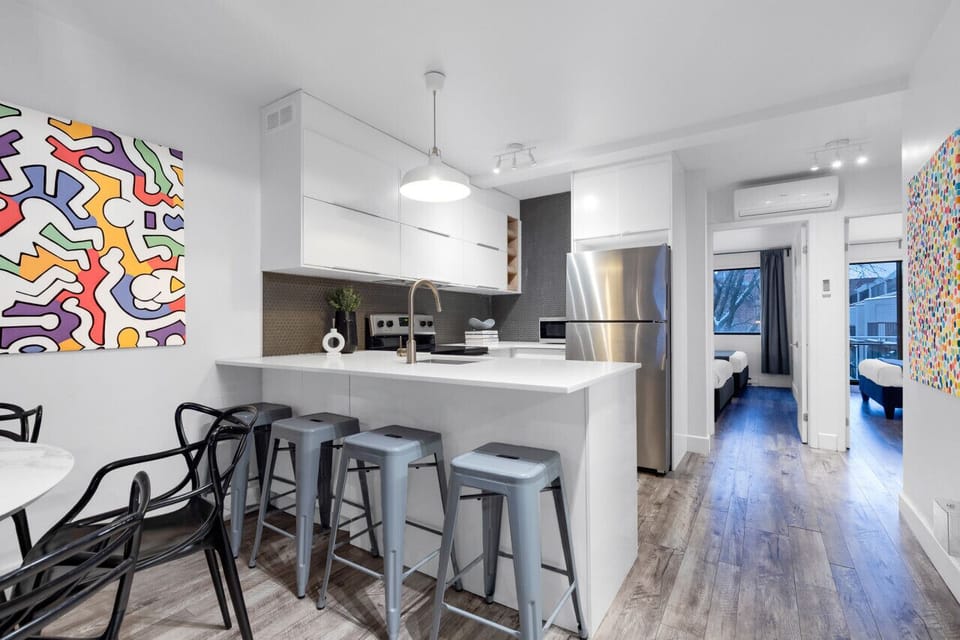 Dining Room: This space features a luxurious dining table with comfortable chairs, bar stools for the kitchen island, and a Smart TV. It`s fully equipped to prepare and enjoy large group events.