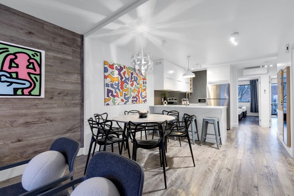 Dining Room: This space features a luxurious dining table with comfortable chairs, bar stools for the kitchen island, and a Smart TV. It`s fully equipped to prepare and enjoy large group events.