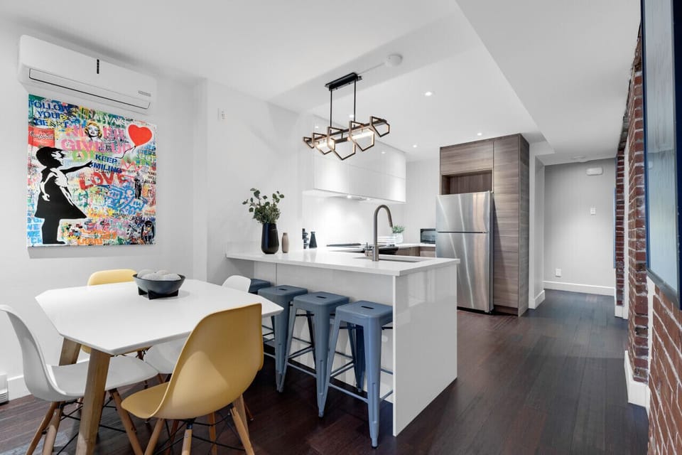 Dining Room: Featuring a luxurious dining table with comfortable chairs and a Smart TV, fully equipped for you to prepare and enjoy large group events.