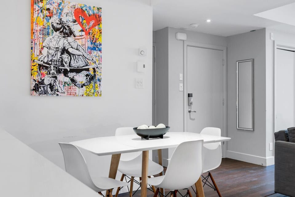Dining Room: Featuring luxurious dining table with comfortable chairs, and a Smart TV, fully equipped for you to prepare and enjoy large group events.