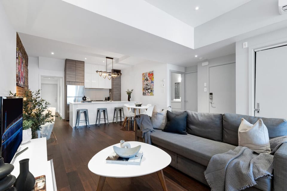 Living Room: Features 2 queen-size sofa beds with Art Deco, and a Smart HD TV with Netflix, YouTube, and Prime.
