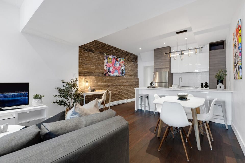 Living Room: Features 2 queen-size sofa beds with Art Deco, and a Smart HD TV with Netflix, YouTube, and Prime.