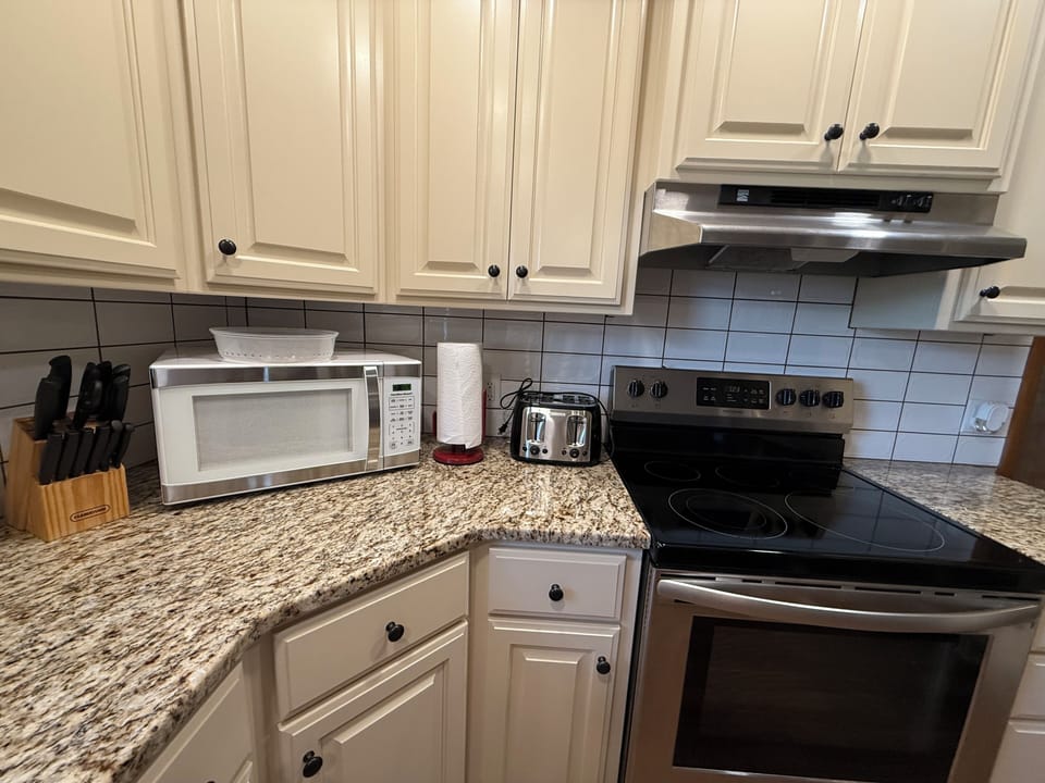 Kitchen with granite counter tops.
