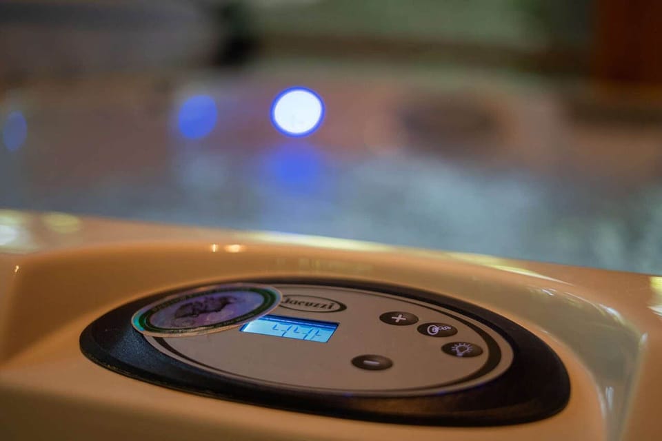 Hot tub temperature is set at 100 degrees. Guests may raise and lower.