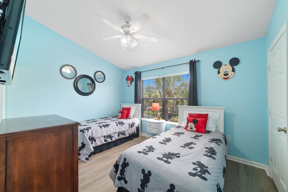 Disney themed bedroom for the young travelers. These are twin size beds. 