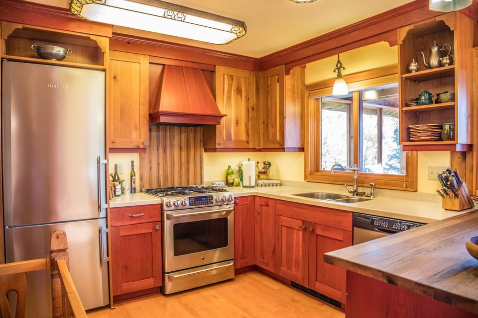 The kitchen features stainless steel appliances