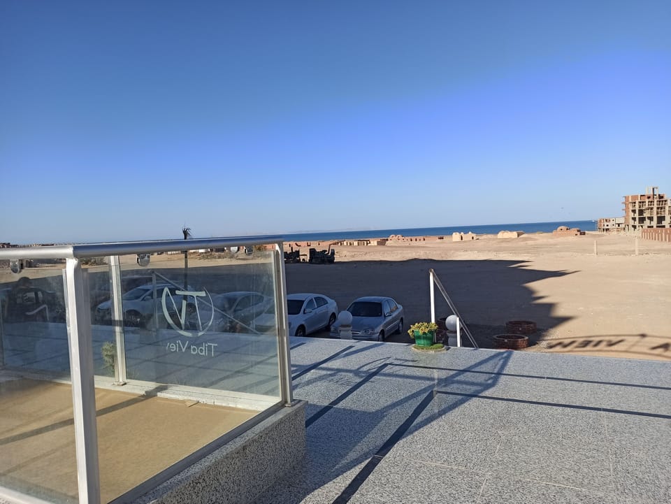 Beach view in front of entrance to Tiba View