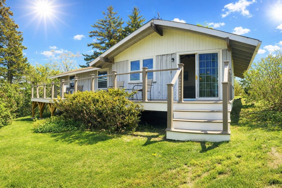 From the lawn, The Studio has a large expansive back deck.