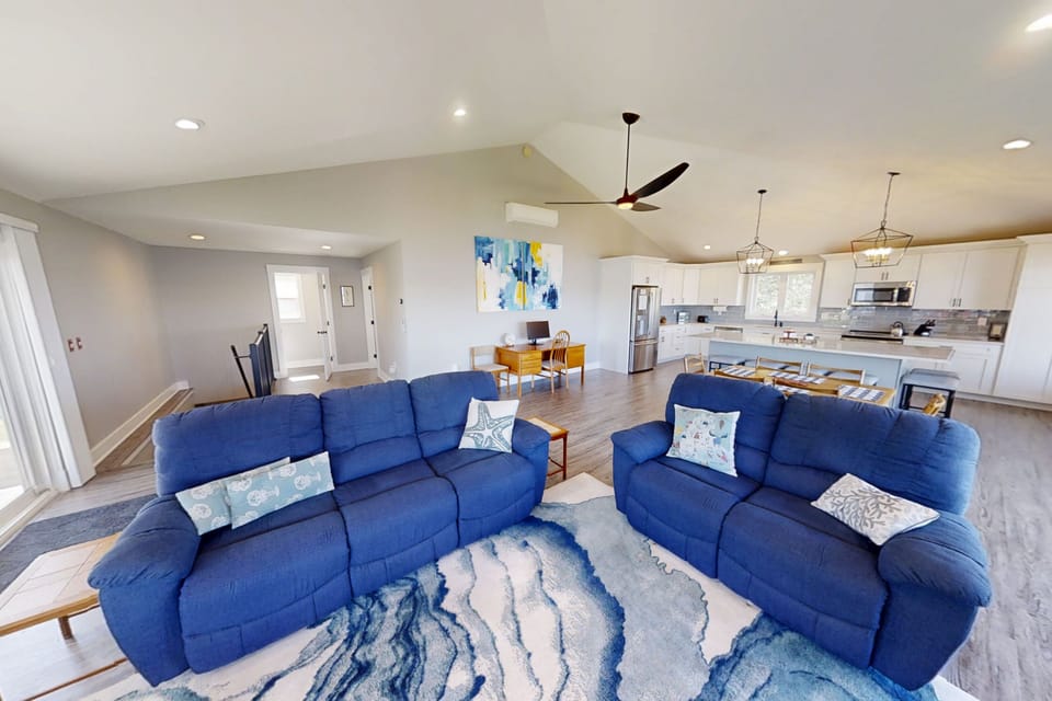 Upper-level open living, dining and kitchen area.