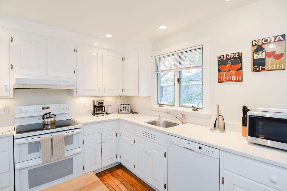 Appliances include an electric range and dishwasher.
