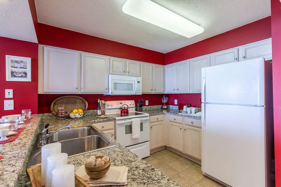 Kitchen with full-size appliances; Refrigerator, Stove, and Dishwasher