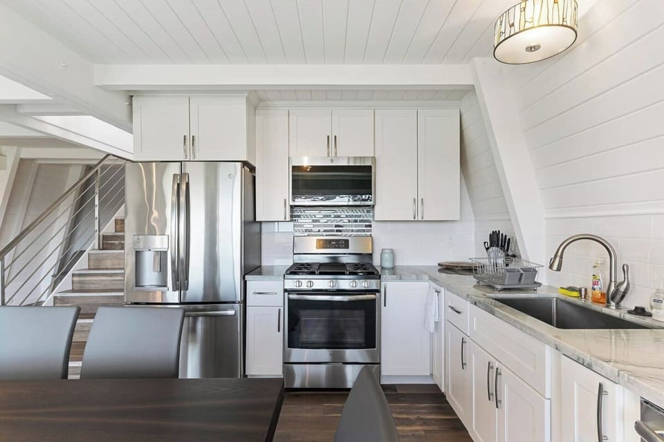 Make delicious meals in this full kitchen in the 3-bedroom unit.