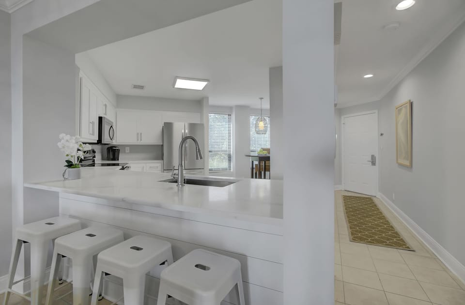 Kitchen with breakfast bar seating.