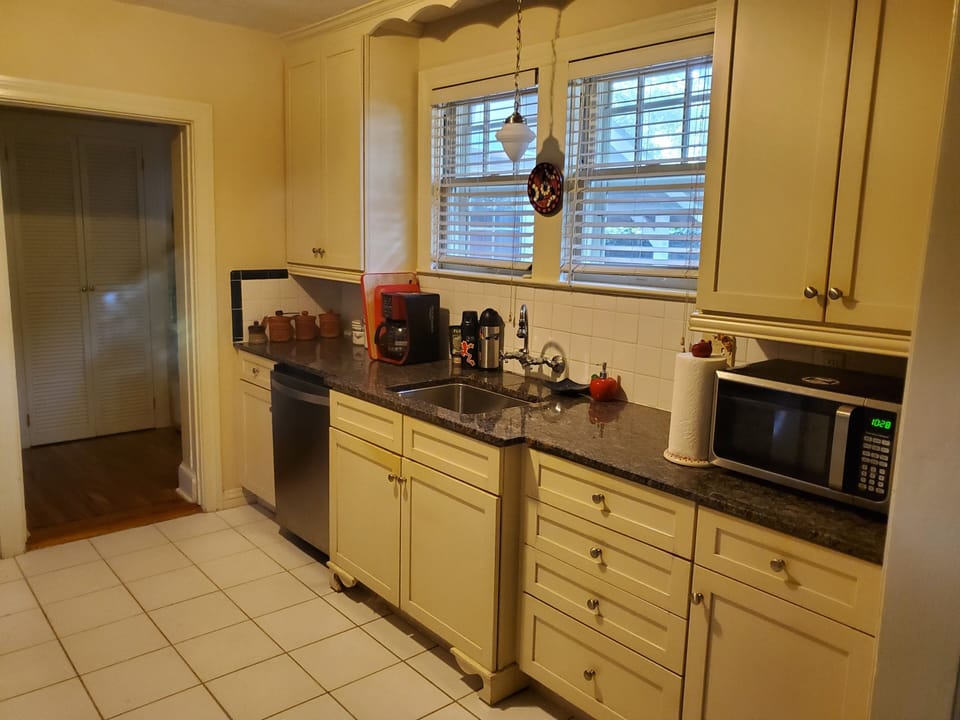 The Kitchen has a microwave, coffee maker, french press and coffee grinder too